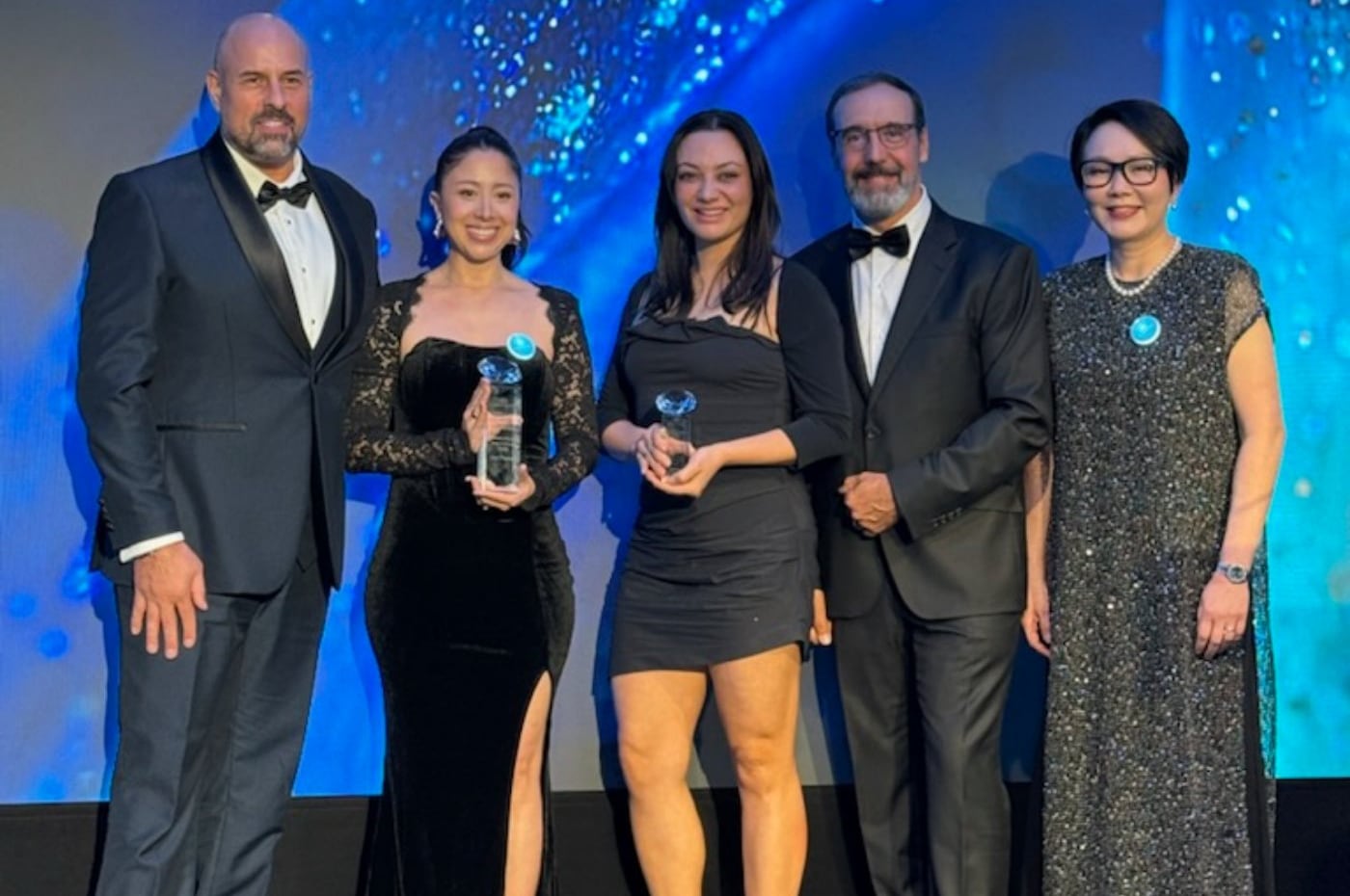 Bruna and the Flow Physique team accepting the InMode Excellence Award 2026 on stage